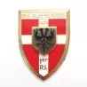 Insigne 1er régiment d'infanterie, forme de bouclier rouge, blanc et or, inscription "On ne relève pas Picardie".