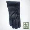 Gants de cuir noir avec un serrage au poignet par bande auto agrippante.