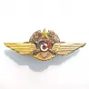 Brevet Observateur Moniteur Pilote de l'ALAT, représentant un écu, 2 canons, 3 anneaux noués une couronne et une paire d'ailes.
