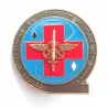 Insigne du Centre de traitement de l'information médicale des armées, illustré d'une croix, une épée, des ailes et encres.